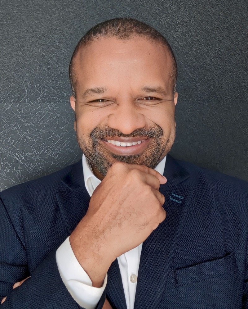 Headshot of Chris Folayan
